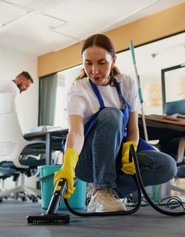 professional-cleaning-service-person-using-vacuum-cleaner-office_23-2150520594