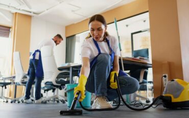 professional-cleaning-service-person-using-vacuum-cleaner-office_23-2150520594
