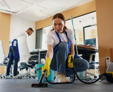 professional-cleaning-service-person-using-vacuum-cleaner-office_23-2150520594