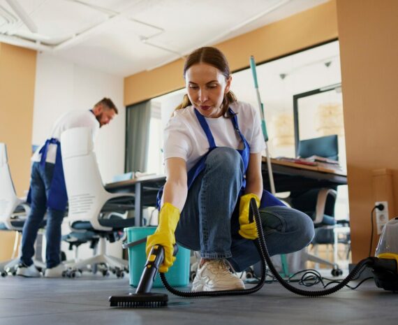 professional-cleaning-service-person-using-vacuum-cleaner-office_23-2150520594
