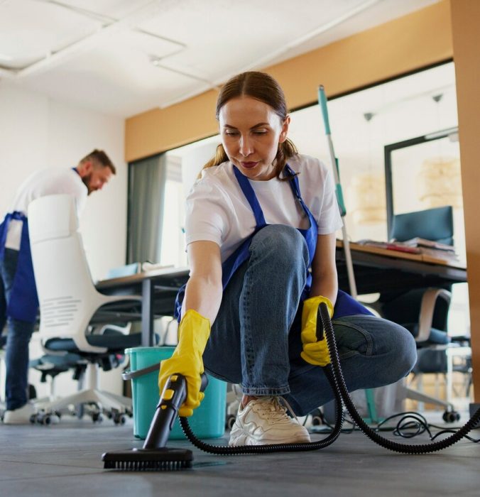 professional-cleaning-service-person-using-vacuum-cleaner-office_23-2150520594
