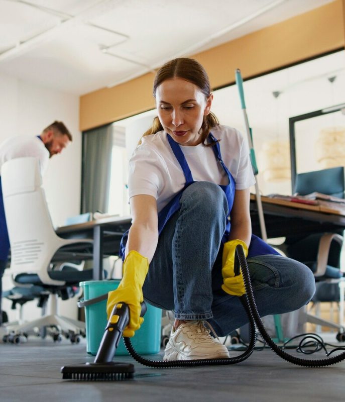 professional-cleaning-service-person-using-vacuum-cleaner-office_23-2150520594
